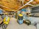 Basement storage space with visible ceiling joists, utilities, and neatly organized storage containers at 1395 Roundstone Rd, Sherrills Ford, NC 28673