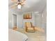 Bedroom featuring light walls, a soft chair, and a view to the adjacent room at 1395 Roundstone Rd, Sherrills Ford, NC 28673