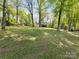 Beautiful two-story home featuring a large lawn and mature trees at 1395 Roundstone Rd, Sherrills Ford, NC 28673