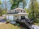 Charming two-story home with a spacious deck and two-car garage at 1395 Roundstone Rd, Sherrills Ford, NC 28673