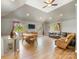 Open floor plan includes a dining area and living room with vaulted ceilings and windows at 1395 Roundstone Rd, Sherrills Ford, NC 28673
