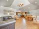 Spacious living area flows into the kitchen with a table and leather sofa for comfortable living at 1395 Roundstone Rd, Sherrills Ford, NC 28673