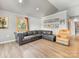 Cozy living area with wood floors, a leather sectional, and a large window at 1395 Roundstone Rd, Sherrills Ford, NC 28673