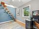Unique office space with a spiral staircase, workstation, and bright windows at 1395 Roundstone Rd, Sherrills Ford, NC 28673