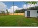A spacious backyard with a wooden fence and a shed, surrounded by lush green grass at 1663 Smyre Farm Rd # 5, Newton, NC 28658