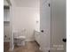 Bathroom featuring a toilet, single sink vanity, and tile floors at 1663 Smyre Farm Rd # 5, Newton, NC 28658