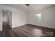 Spacious bedroom featuring wood-look flooring and a window with a view at 1663 Smyre Farm Rd # 5, Newton, NC 28658