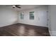 Spacious bedroom with wood flooring, ample natural light, and a ceiling fan at 1663 Smyre Farm Rd # 5, Newton, NC 28658