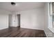Bright bedroom featuring wood-look flooring and a view from the window at 1663 Smyre Farm Rd # 5, Newton, NC 28658
