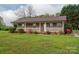 Well-kept brick home featuring a covered front porch and neatly manicured lawn at 1663 Smyre Farm Rd # 5, Newton, NC 28658