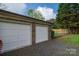 Garage exterior showcasing two white doors and brick siding at 1663 Smyre Farm Rd # 5, Newton, NC 28658