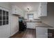 Modern kitchen with white cabinets, granite countertops, and stainless steel appliances at 1663 Smyre Farm Rd # 5, Newton, NC 28658