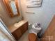 Bathroom featuring vanity, toilet, and warm interior at 171 Grand View Dr, New London, NC 28127