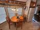 Cozy dining area with wood table, chairs, and natural light from the nearby window at 171 Grand View Dr, New London, NC 28127