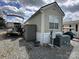 Exterior home shot displaying a boat and air conditioner in the gravel yard at 171 Grand View Dr, New London, NC 28127