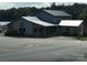 Exterior view of the Badin Shores Marina office with plenty of parking at 171 Grand View Dr, New London, NC 28127