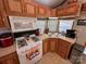 Functional kitchen design featuring ample cabinetry, modern appliances, and a corner sink with a window view at 171 Grand View Dr, New London, NC 28127