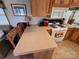 Efficient kitchen layout with a breakfast bar, modern appliances, and plenty of counter space at 171 Grand View Dr, New London, NC 28127