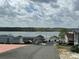 Scenic view of a waterfront community with homes lining the lake, showcasing a peaceful setting at 171 Grand View Dr, New London, NC 28127