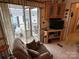 Comfortable living room with cozy seating and sliding doors leading to an outdoor deck at 171 Grand View Dr, New London, NC 28127