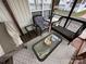 Outdoor porch featuring wicker furniture, a glass table, and a cozy atmosphere at 171 Grand View Dr, New London, NC 28127