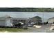 Scenic lakefront homes with jet skis and boat trailers ready for summer recreation at 171 Grand View Dr, New London, NC 28127