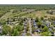 Aerial view showcasing neighborhood, surrounding golf course, ponds, and green spaces nearby at 181 Glynwater Dr, Mooresville, NC 28117