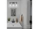 Modern bathroom features stylish light fixture, vanity sink, and sleek design elements at 181 Glynwater Dr, Mooresville, NC 28117