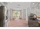 Cozy breakfast nook with stainless steel appliances, large window, and bar height countertop with chairs at 181 Glynwater Dr, Mooresville, NC 28117
