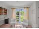 Bright breakfast nook with comfortable seating, natural light, and built-in bar height countertop for enjoying meals at 181 Glynwater Dr, Mooresville, NC 28117