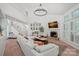 Inviting living room with fireplace, high ceilings, large windows, and comfortable seating area at 181 Glynwater Dr, Mooresville, NC 28117