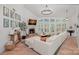 Inviting living room with fireplace, high ceilings, large windows, and comfortable seating area at 181 Glynwater Dr, Mooresville, NC 28117