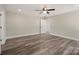 Bedroom featuring luxury vinyl plank flooring, neutral walls, ceiling fan and plentiful natural light at 203 E 27Th St, Kannapolis, NC 28083