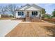Charming home with a brick foundation, inviting porch, and newly laid lawn at 203 E 27Th St, Kannapolis, NC 28083