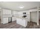 Bright kitchen featuring white cabinets, stainless steel appliances, and a center island at 203 E 27Th St, Kannapolis, NC 28083