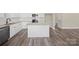 Open kitchen design featuring white cabinets, an island, and stainless steel appliances at 203 E 27Th St, Kannapolis, NC 28083
