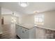 Kitchen island with granite countertop provides extra workspace and seating in a bright, airy kitchen at 203 E 27Th St, Kannapolis, NC 28083