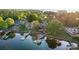 Stunning aerial view showcasing waterfront homes, private docks, and lush greenery at 20428 Island Forest Dr, Cornelius, NC 28031