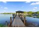 Dock view showcasing boat access and lovely views of the surrounding waterway and neighborhood at 20428 Island Forest Dr, Cornelius, NC 28031
