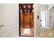 Interior view of a wood-paneled elevator with a marble floor, showcasing luxury and convenience at 20428 Island Forest Dr, Cornelius, NC 28031