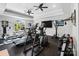 Bright home gym with modern equipment and large windows at 20428 Island Forest Dr, Cornelius, NC 28031