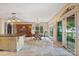 Eat-in kitchen showcasing natural light, pendant lighting, travertine floors and access to outdoor deck at 20428 Island Forest Dr, Cornelius, NC 28031