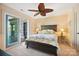 Cozy main bedroom with a ceiling fan, access to the balcony, and comfortable furnishings, a serene retreat at 20428 Island Forest Dr, Cornelius, NC 28031