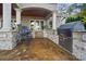 Outdoor kitchen with built-in grill, stone countertops, and bar seating at 20428 Island Forest Dr, Cornelius, NC 28031