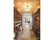 Custom wine cellar featuring brick ceiling, custom wooden shelving, lighting and temperature controls at 20428 Island Forest Dr, Cornelius, NC 28031