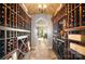 Custom wine cellar has brick ceiling and can be temperature controlled to perfectly store your wine collection at 20428 Island Forest Dr, Cornelius, NC 28031