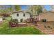 View of the backyard featuring a lush lawn, exterior of the house, and wooden deck at 2239 Wensley Dr, Charlotte, NC 28210
