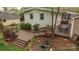 View of the backyard featuring a lush lawn, exterior of the house, and wooden deck at 2239 Wensley Dr, Charlotte, NC 28210
