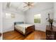 Sunny bedroom with hardwood floors, ceiling fan, and plenty of natural light at 2239 Wensley Dr, Charlotte, NC 28210