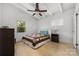 Bright bedroom with hardwood floors, ceiling fan, and natural light from two windows at 2239 Wensley Dr, Charlotte, NC 28210
